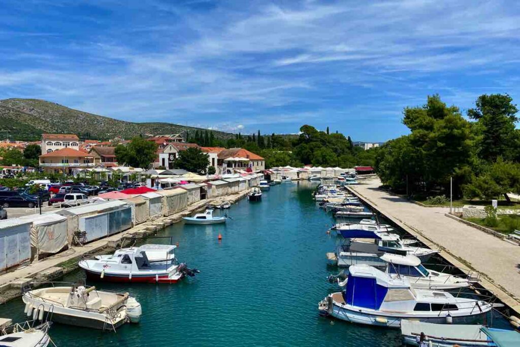 Trogir Market alongside the waterfront with boats in Croatia